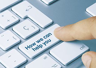 Keyboard key reading “How we can help you”